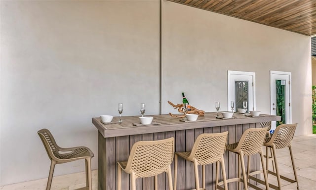 bar featuring wooden ceiling