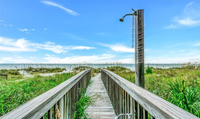 view of community featuring a water view and a view of the beach