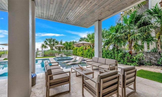 view of patio / terrace with outdoor lounge area and a swimming pool with hot tub