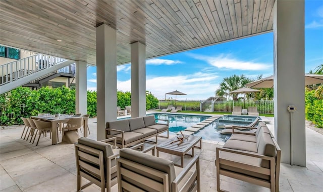 view of patio featuring a fenced in pool and an outdoor hangout area