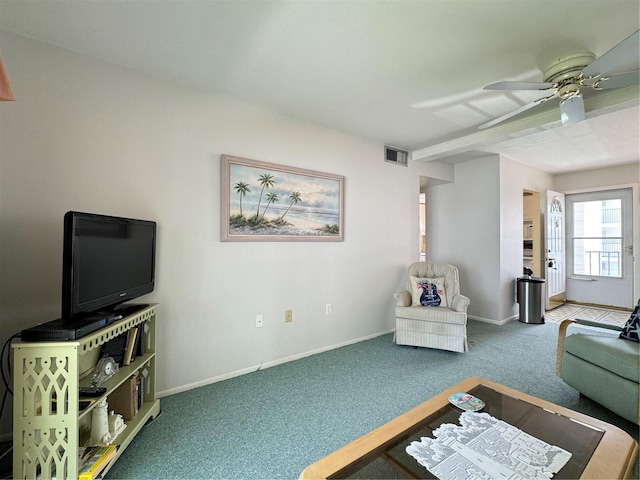 living room with carpet and ceiling fan