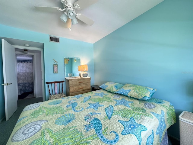 bedroom featuring ceiling fan and dark carpet