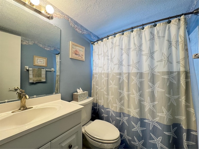 bathroom featuring a shower with curtain, vanity, toilet, and a textured ceiling