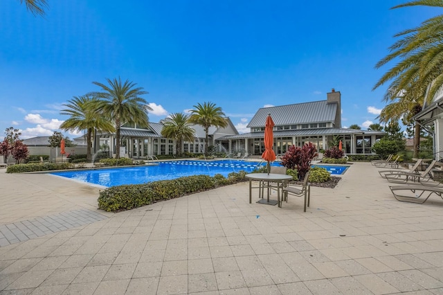 view of swimming pool with a patio area