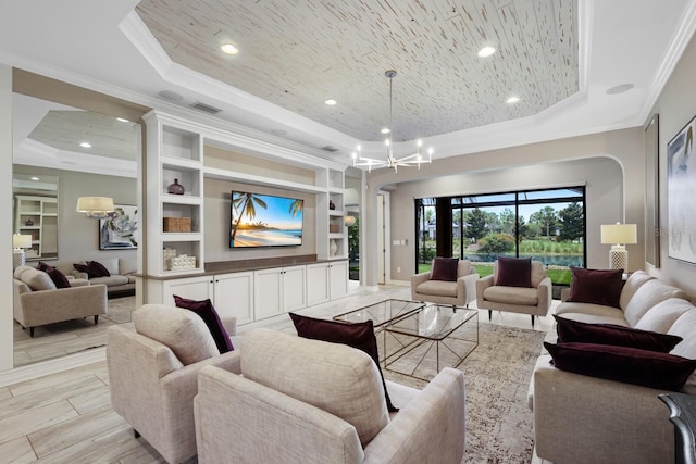 living room with built in features, light hardwood / wood-style flooring, a raised ceiling, and ornamental molding