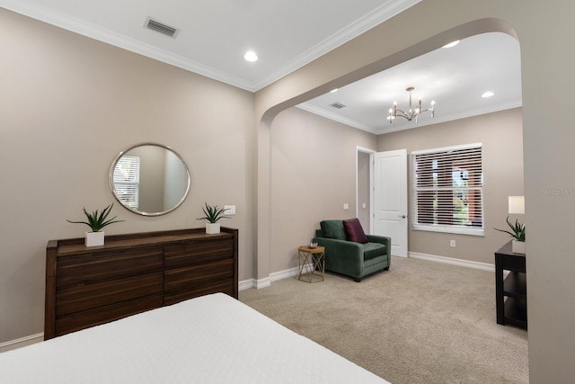 carpeted bedroom with crown molding and an inviting chandelier