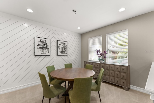 dining room featuring light colored carpet