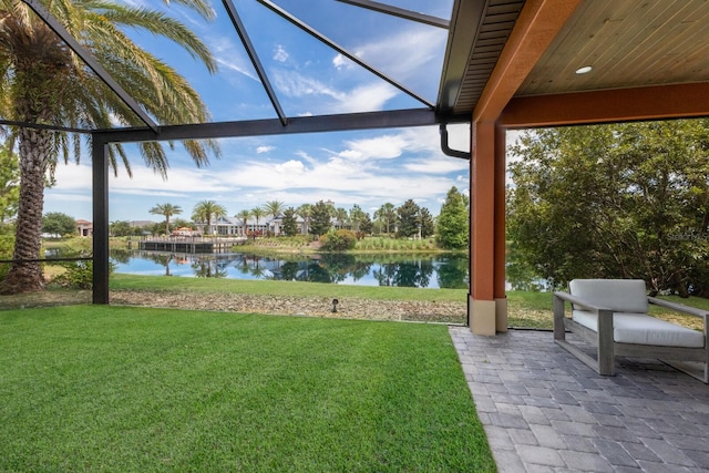 view of yard with a patio and a water view