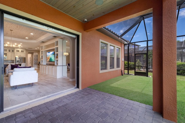 view of patio / terrace with a lanai