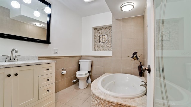 bathroom with a stall shower, toilet, a tub with jets, tile patterned flooring, and vanity