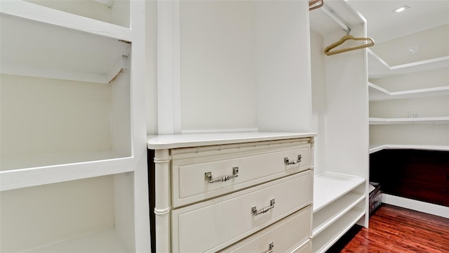 spacious closet featuring hardwood / wood-style flooring