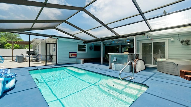 view of swimming pool with a patio, a lanai, and a fenced in pool