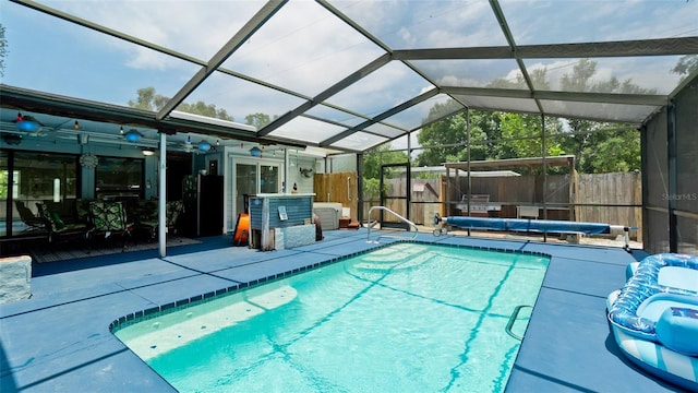 view of pool with a patio, a fenced backyard, a lanai, and a fenced in pool