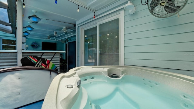 exterior details featuring a hot tub