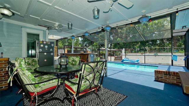 view of pool with a fenced in pool, a ceiling fan, a patio, outdoor dry bar, and fence