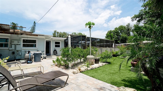 view of patio / terrace featuring a lanai