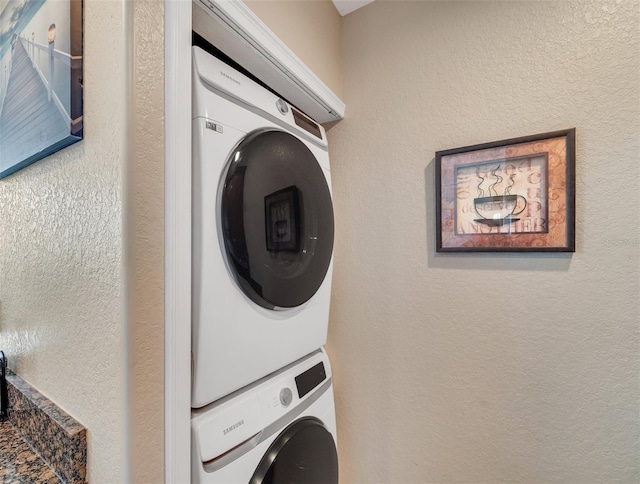 laundry area with stacked washer and dryer