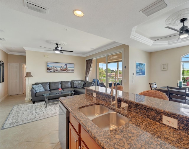 kitchen with sink, light tile patterned floors, dishwasher, and ceiling fan