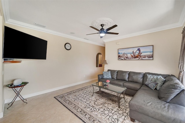 tiled living room featuring ornamental molding and ceiling fan