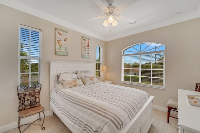 bedroom with light carpet, ceiling fan, and ornamental molding