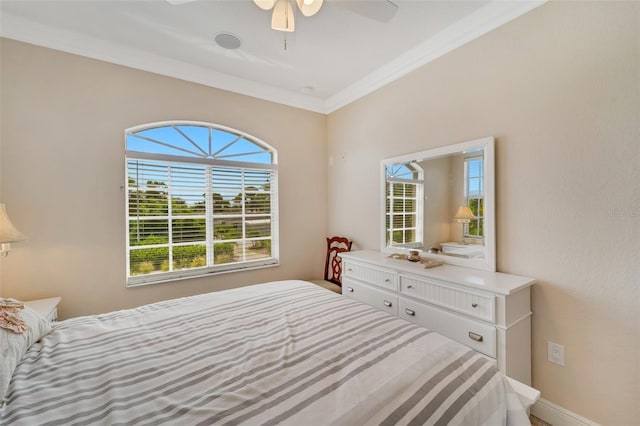 bedroom with ornamental molding and ceiling fan