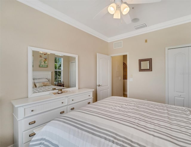 bedroom with a closet, ceiling fan, and crown molding