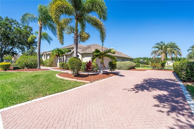 view of front of house with a front lawn and a garage