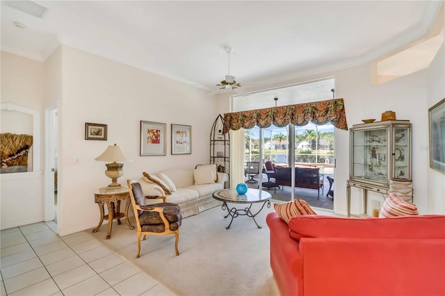 living room featuring light tile patterned floors, ceiling fan, and crown molding