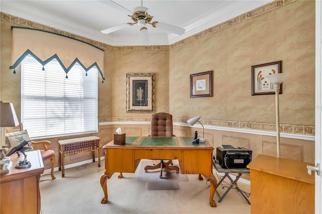 carpeted home office featuring ceiling fan and ornamental molding