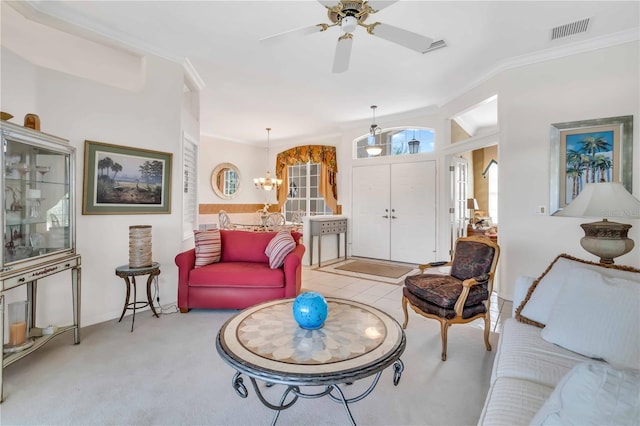 living room featuring lofted ceiling, light colored carpet, ornamental molding, and ceiling fan with notable chandelier