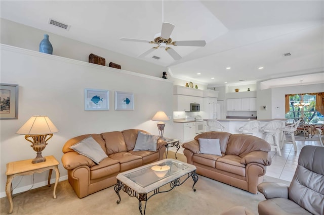 tiled living room with ceiling fan