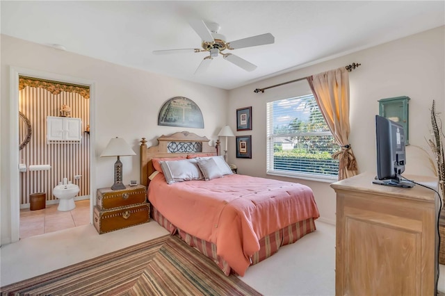 bedroom featuring ceiling fan and light carpet