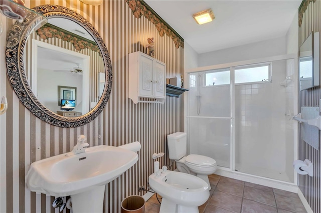 bathroom featuring ceiling fan, tile patterned floors, a bidet, an enclosed shower, and toilet