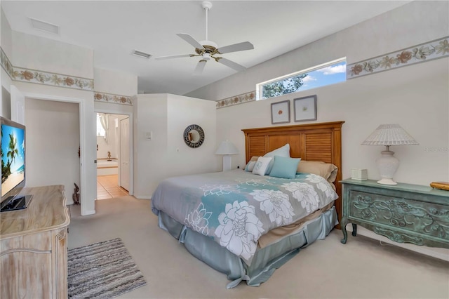 carpeted bedroom featuring connected bathroom and ceiling fan