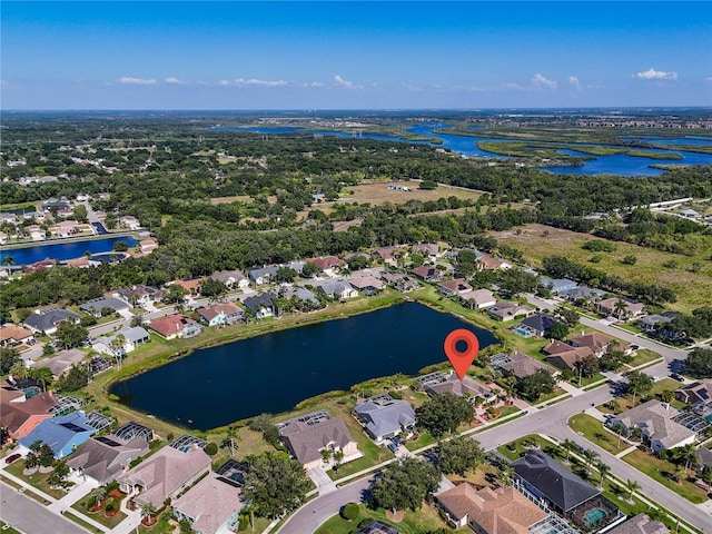 birds eye view of property featuring a water view