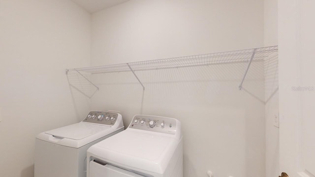 laundry room with washer and dryer