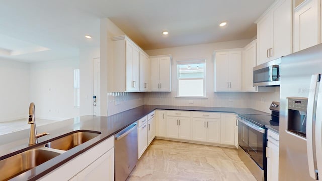 kitchen with white cabinets, sink, and stainless steel appliances