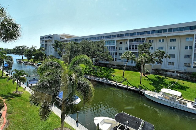 exterior space featuring a water view and a lawn