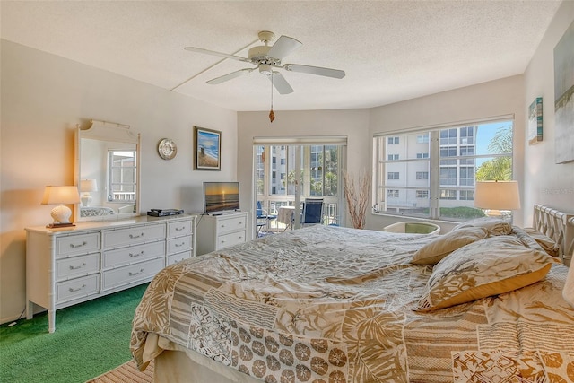 bedroom featuring carpet floors, access to outside, a ceiling fan, and a textured ceiling