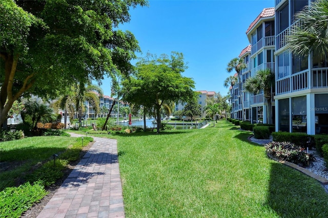 view of home's community with a lawn