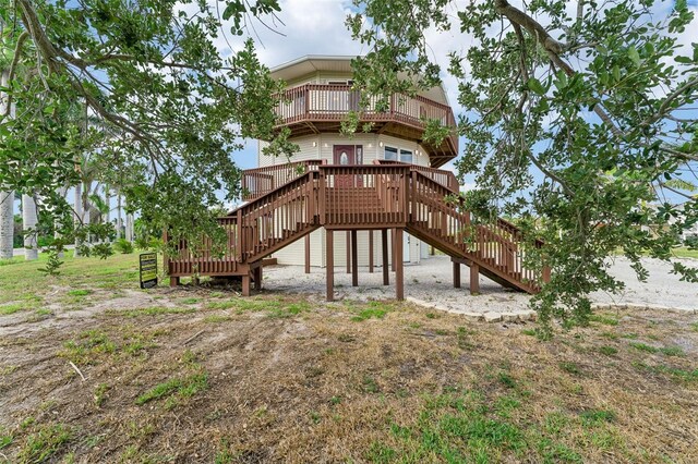 16361 Stringfellow Rd, Bokeelia, FL 33922 - rear view of property with stairs, a balcony, and a deck