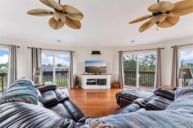 16361 Stringfellow Rd, Bokeelia, FL 33922 - living area featuring plenty of natural light, wood finished floors, and a ceiling fan