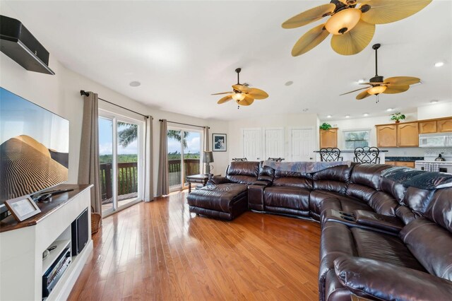 16361 Stringfellow Rd, Bokeelia, FL 33922 - living room featuring a ceiling fan, light wood-style floors, and recessed lighting