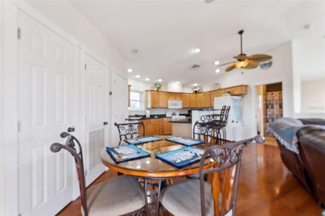 16361 Stringfellow Rd, Bokeelia, FL 33922 - dining space with ceiling fan, wood finished floors, recessed lighting, and vaulted ceiling