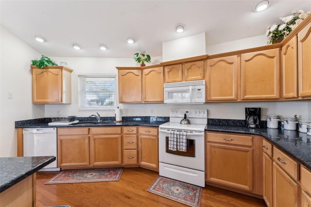 16361 Stringfellow Rd, Bokeelia, FL 33922 - kitchen with white appliances, a sink, light wood finished floors, and dark stone countertops