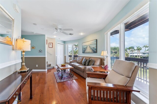 16361 Stringfellow Rd, Bokeelia, FL 33922 - living room with stairs, wood finished floors, ceiling fan, recessed lighting, and baseboards