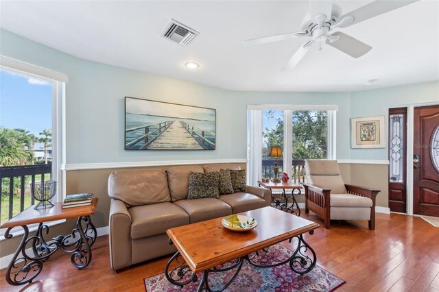 16361 Stringfellow Rd, Bokeelia, FL 33922 - living room featuring wood finished floors, ceiling fan, and baseboards