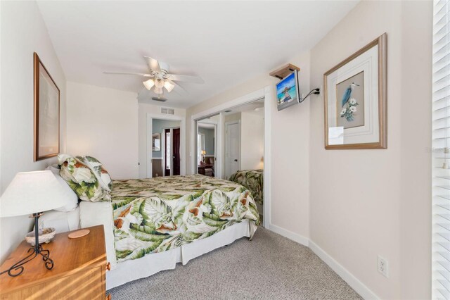 16361 Stringfellow Rd, Bokeelia, FL 33922 - bedroom with carpet, a closet, baseboards, and a ceiling fan