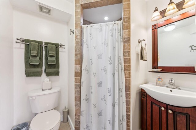 16361 Stringfellow Rd, Bokeelia, FL 33922 - bathroom with vanity, toilet, and curtained shower