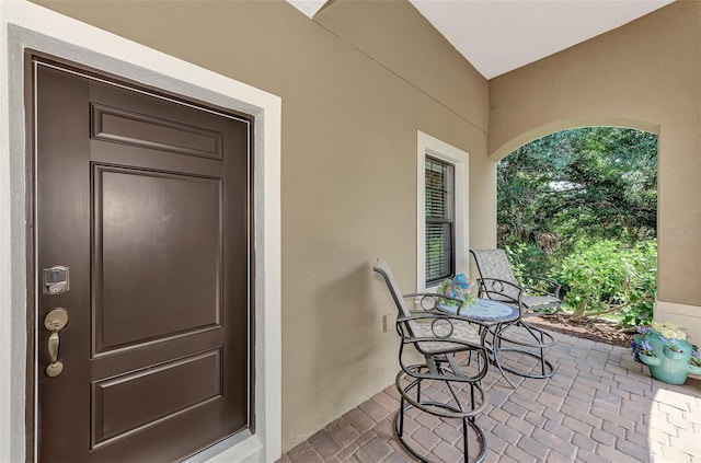 doorway to property with covered porch